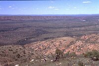 Always wait until noon before you climb a hill in the tropics!<br>In the background the MacDonald Ranges and somewhere far away Glen Helen.